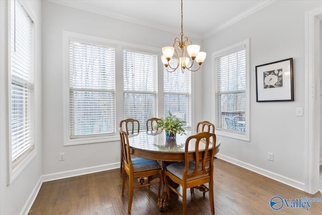 dining area featuring an inviting chandelier, baseboards, ornamental molding, and wood finished floors