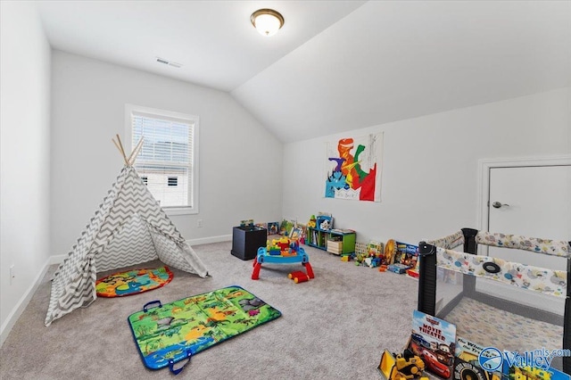 playroom featuring vaulted ceiling, carpet, visible vents, and baseboards