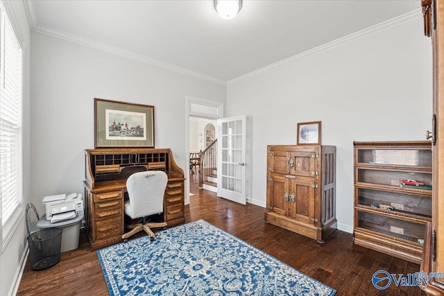 office area featuring arched walkways, french doors, ornamental molding, and dark wood finished floors