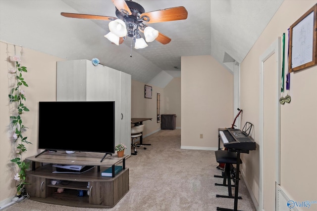 living area with baseboards, carpet floors, ceiling fan, and vaulted ceiling