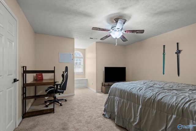 bedroom featuring a textured ceiling, visible vents, baseboards, ceiling fan, and carpet floors