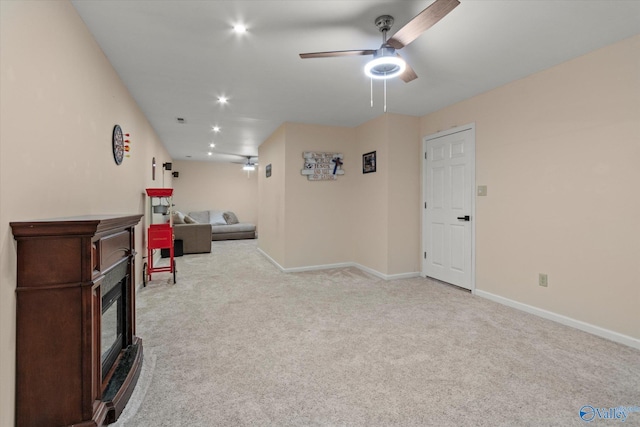 sitting room featuring baseboards, carpet flooring, recessed lighting, and a ceiling fan