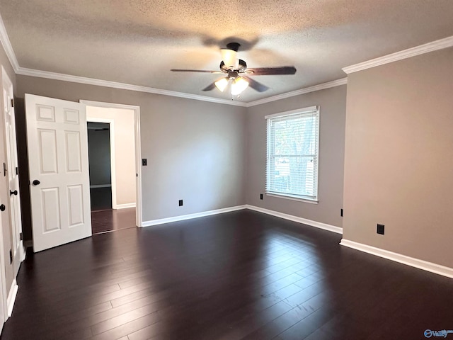 spare room with dark hardwood / wood-style floors, crown molding, and a textured ceiling