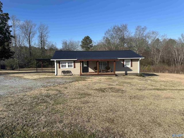 ranch-style home with a front lawn and a carport