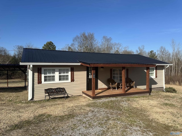 view of front of house featuring a front yard and a wooden deck