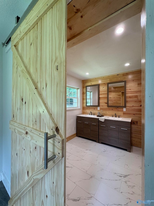 bathroom with wood walls and vanity