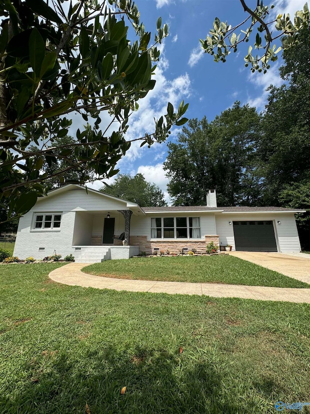 single story home featuring a garage and a front lawn