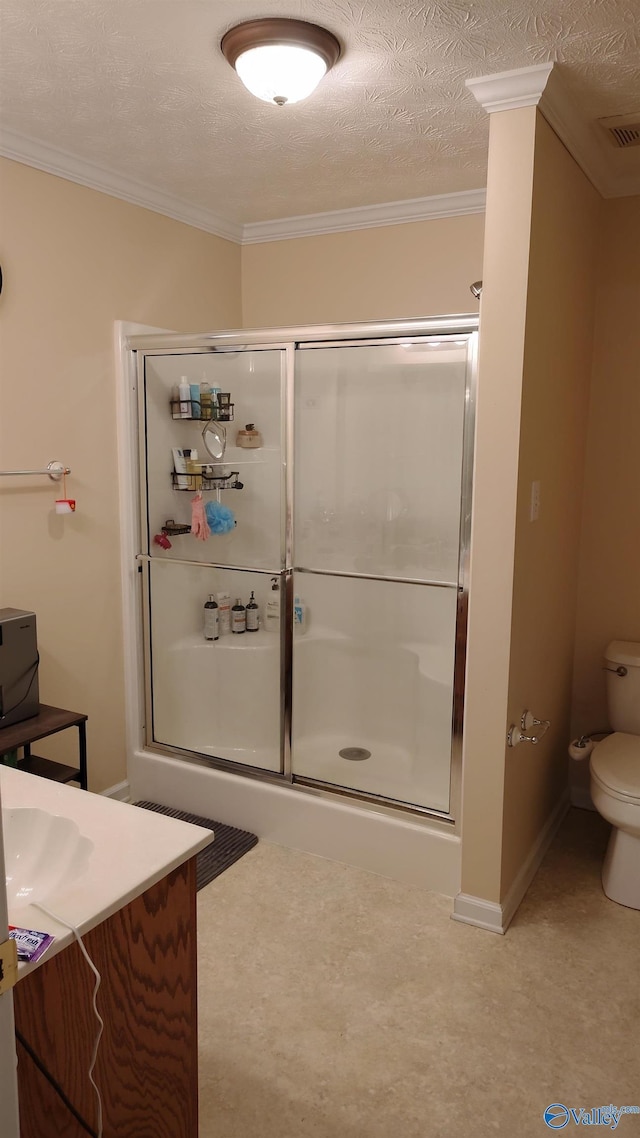 full bathroom featuring visible vents, crown molding, a shower stall, and toilet