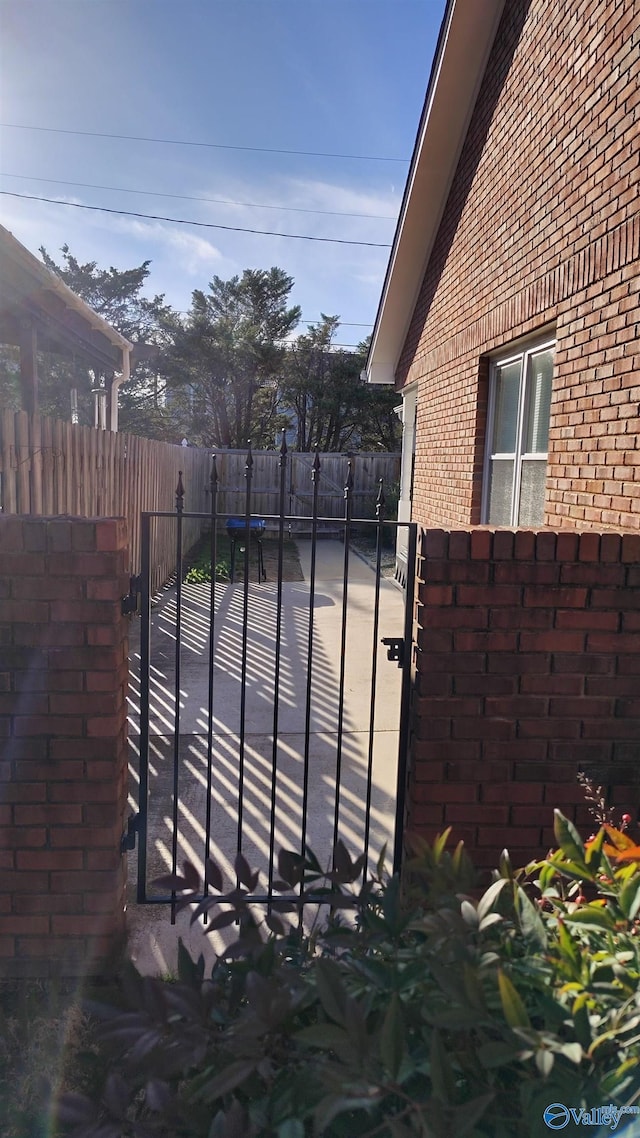 view of gate featuring fence