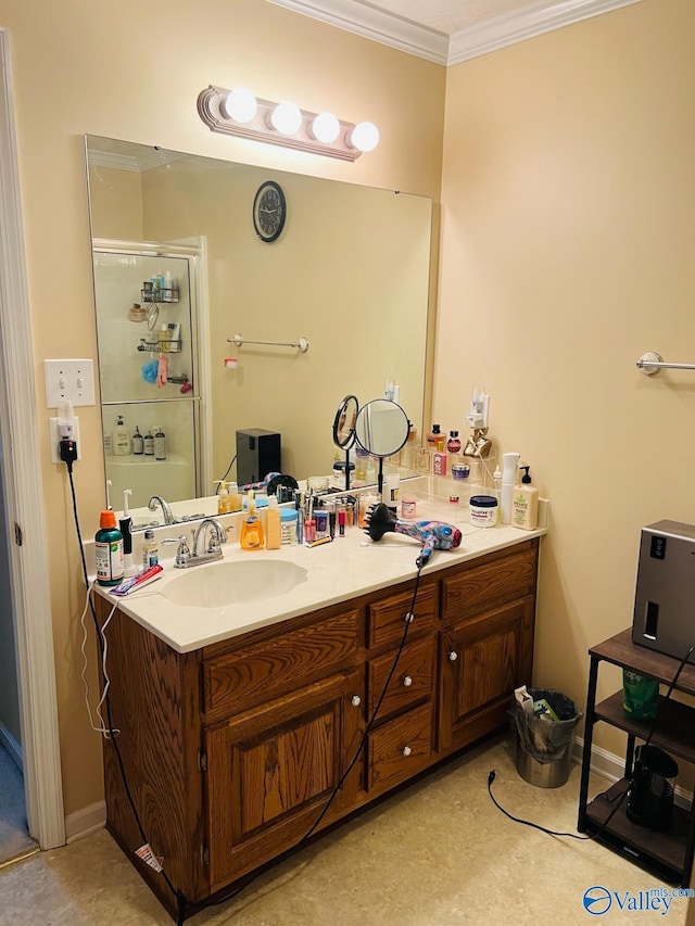 full bath featuring an enclosed shower, ornamental molding, and vanity