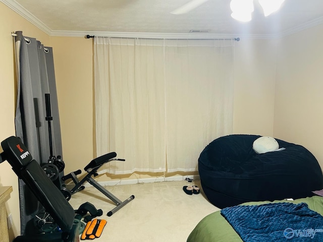 bedroom with ornamental molding and carpet flooring