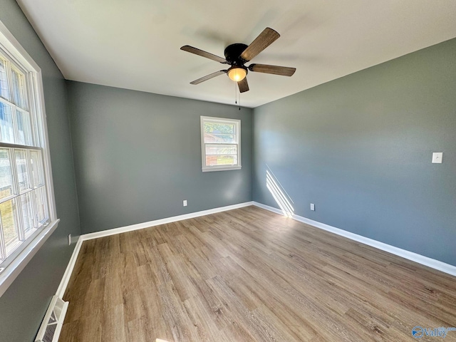 spare room featuring light wood-type flooring and ceiling fan