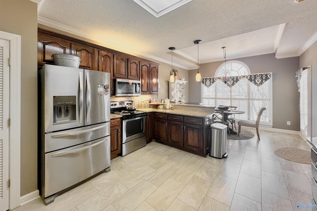 kitchen featuring a chandelier, dark brown cabinets, ornamental molding, appliances with stainless steel finishes, and pendant lighting