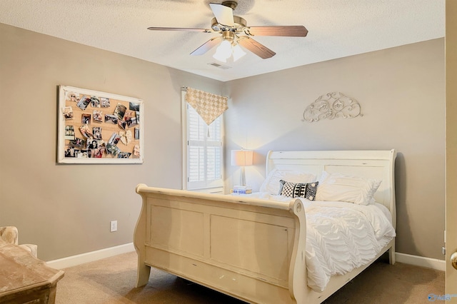 bedroom featuring light carpet, visible vents, baseboards, and a textured ceiling