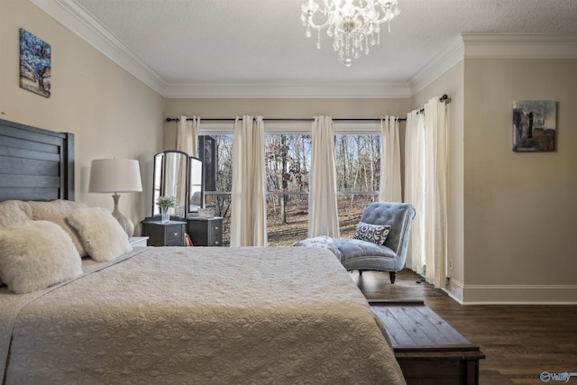 bedroom with a textured ceiling, an inviting chandelier, ornamental molding, and dark hardwood / wood-style floors