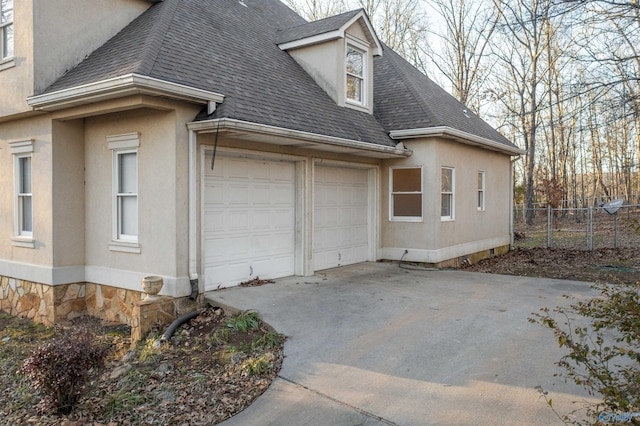 view of side of property featuring a garage