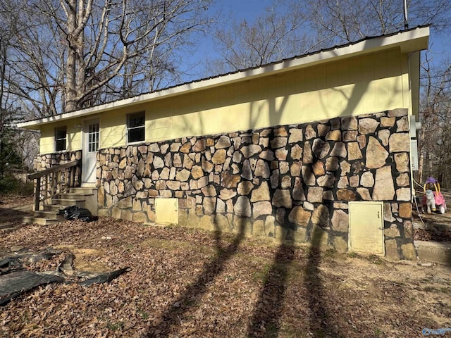 87 Flattop Cir, Scottsboro, AL 35768 - view of home's exterior with crawl space and stone siding