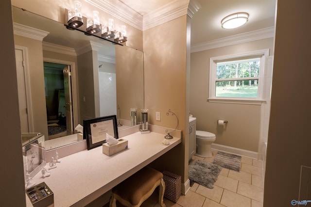bathroom with baseboards, toilet, tile patterned floors, crown molding, and vanity