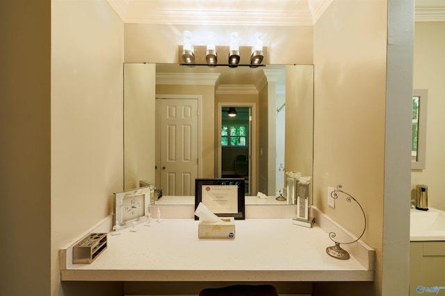 bathroom with ornamental molding and a sink