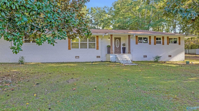 single story home featuring a front yard, crawl space, and brick siding