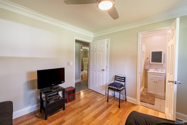 bedroom with light wood finished floors and baseboards