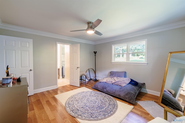 bedroom featuring light wood-style floors, ornamental molding, baseboards, and ceiling fan