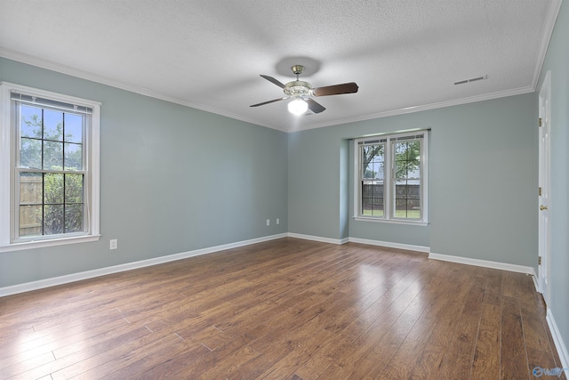 2303 Chatam Ave, Decatur, AL 35603 - spare room featuring healthy amount of natural light, a ceiling fan, dark wood-type flooring, baseboards, and crown molding