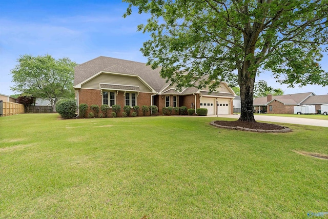 2303 Chatam Ave, Decatur, AL 35603 - view of front of home featuring a garage, brick siding, and driveway