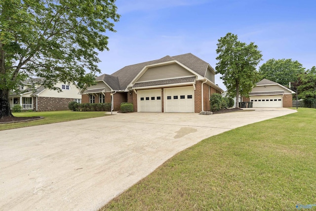 2303 Chatam Ave, Decatur, AL 35603 - view of front facade featuring brick siding, a front lawn, driveway, and a garage