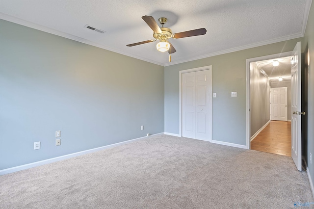 2303 Chatam Ave, Decatur, AL 35603 - unfurnished bedroom with attic access, carpet floors, crown molding, baseboards, and a closet