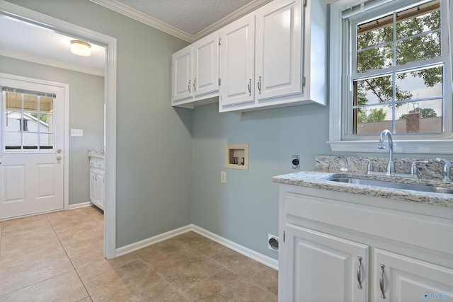 2303 Chatam Ave, Decatur, AL 35603 - laundry area featuring hookup for a washing machine, cabinet space, hookup for an electric dryer, crown molding, and baseboards