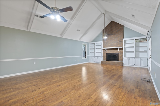 2303 Chatam Ave, Decatur, AL 35603 - unfurnished living room with ceiling fan, baseboards, wood-type flooring, and built in features