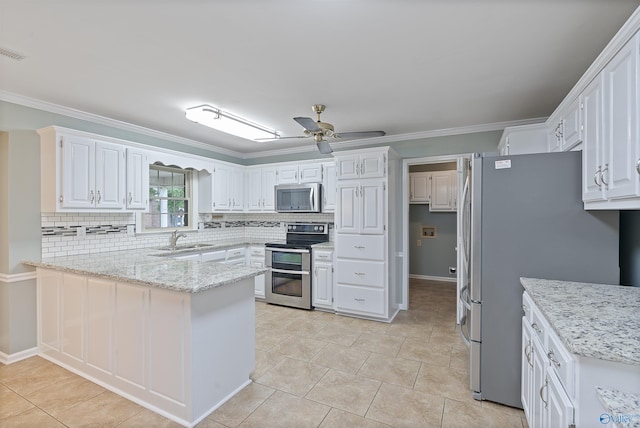2303 Chatam Ave, Decatur, AL 35603 - kitchen with appliances with stainless steel finishes, a peninsula, ceiling fan, decorative backsplash, and ornamental molding
