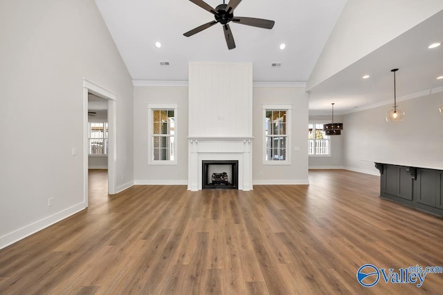 unfurnished living room featuring crown molding, ceiling fan, high vaulted ceiling, and hardwood / wood-style flooring