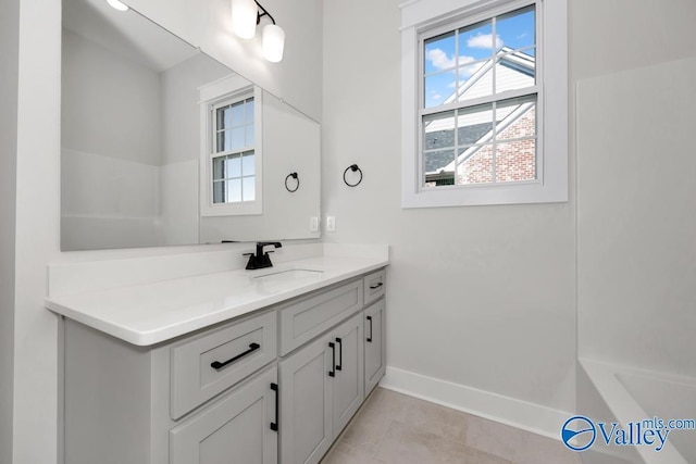 bathroom featuring tile patterned flooring and vanity