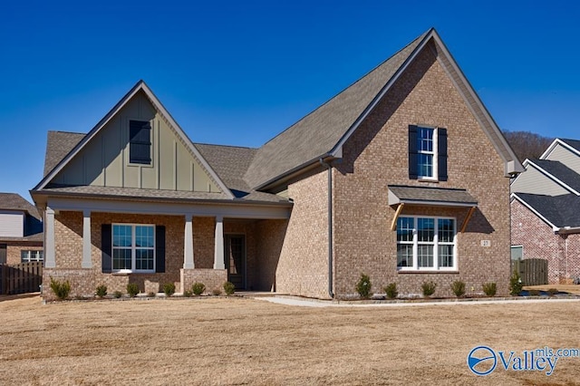 view of front of house featuring a front lawn and covered porch