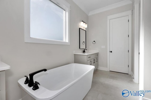 bathroom with vanity and a tub