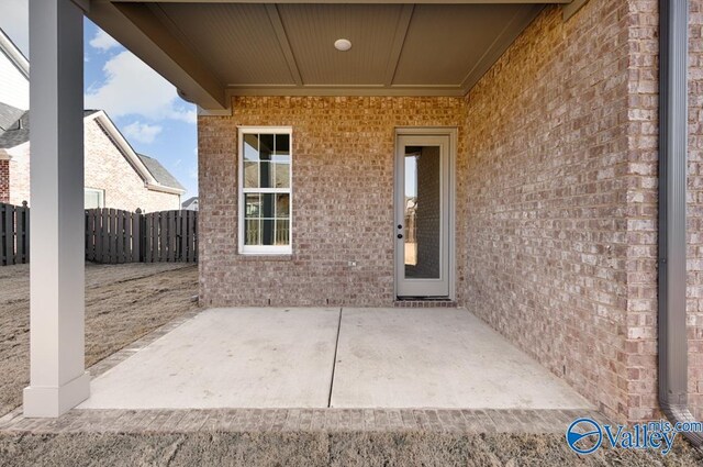 doorway to property featuring a patio area