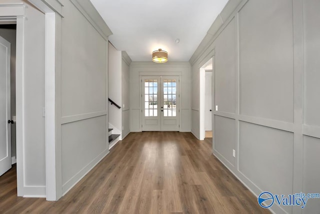 entryway with hardwood / wood-style flooring and french doors