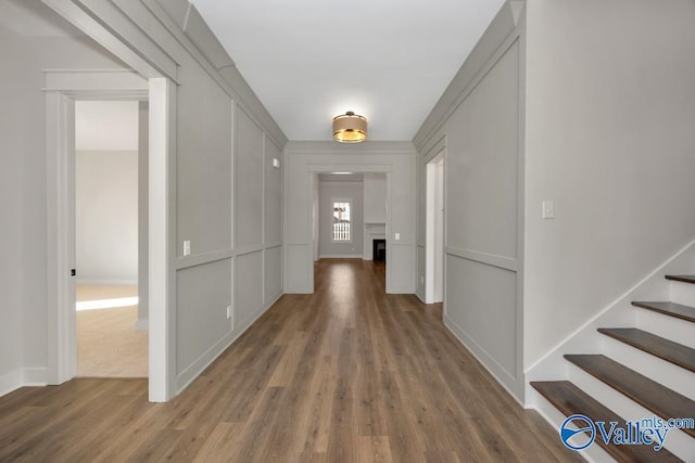 hallway with dark hardwood / wood-style floors