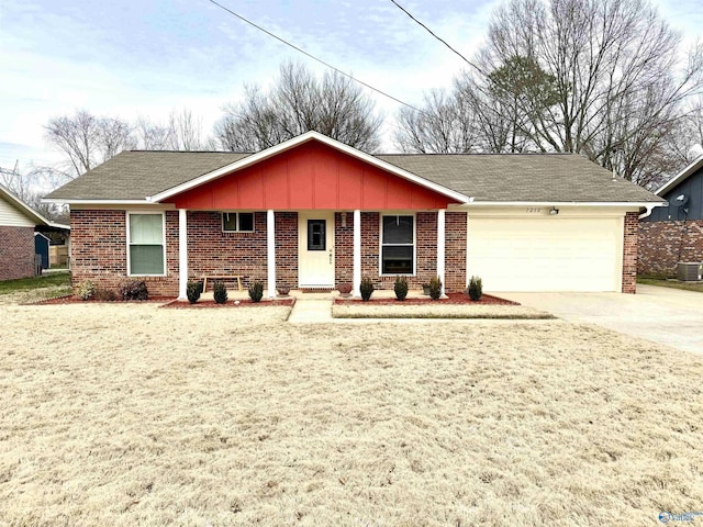 single story home with brick siding, driveway, and an attached garage