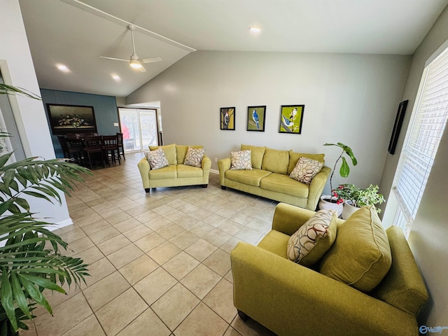 living room featuring light tile patterned flooring, vaulted ceiling, and ceiling fan