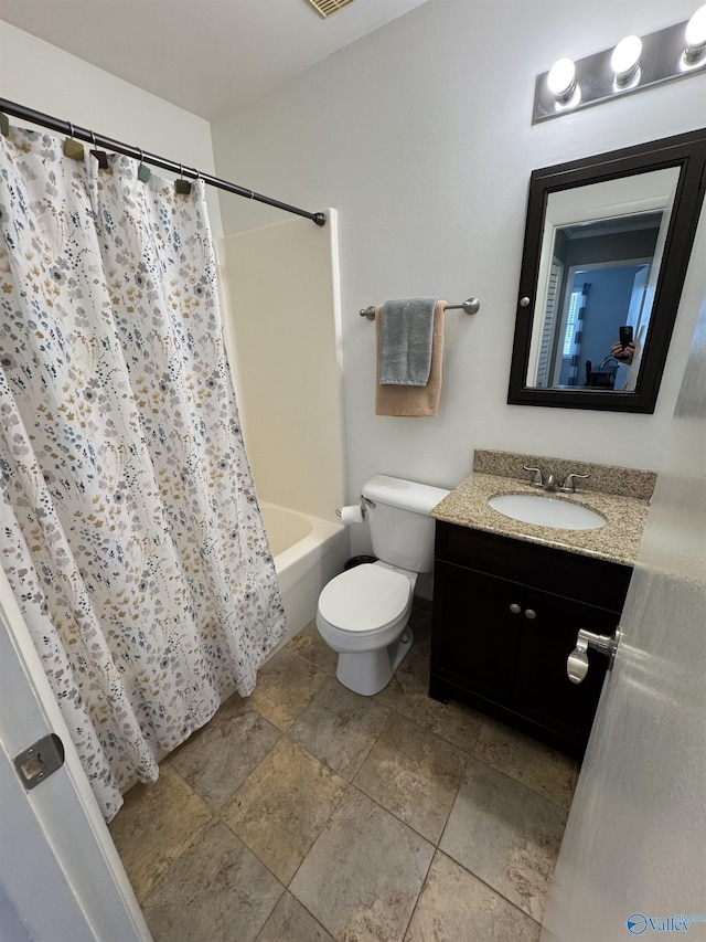 bathroom with toilet, shower / bath combo with shower curtain, and vanity