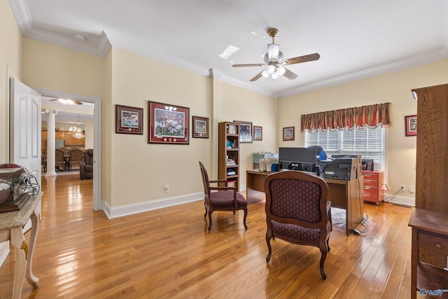 office space with light wood-type flooring, a ceiling fan, and crown molding