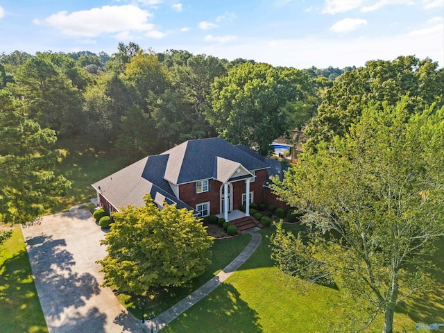 drone / aerial view with a view of trees