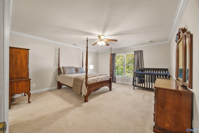 bedroom featuring ornamental molding, light carpet, and baseboards