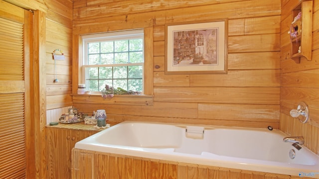 bathroom featuring wooden walls