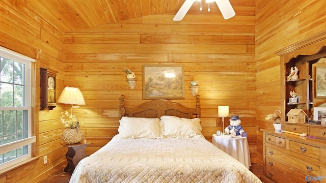 bedroom with wood walls, hardwood / wood-style floors, lofted ceiling, wooden ceiling, and ceiling fan