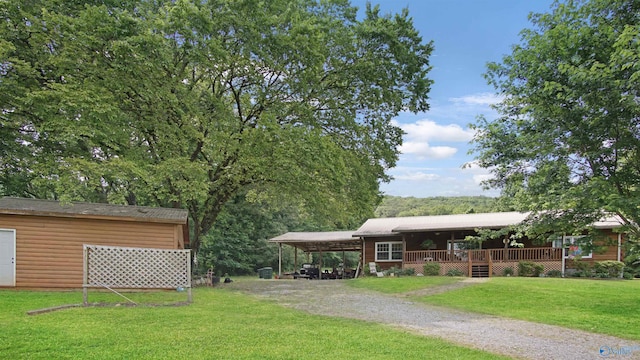 view of front facade featuring a front lawn and a deck