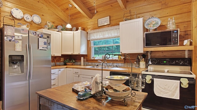 kitchen with lofted ceiling with beams, white cabinetry, stainless steel refrigerator with ice dispenser, wooden walls, and white electric range